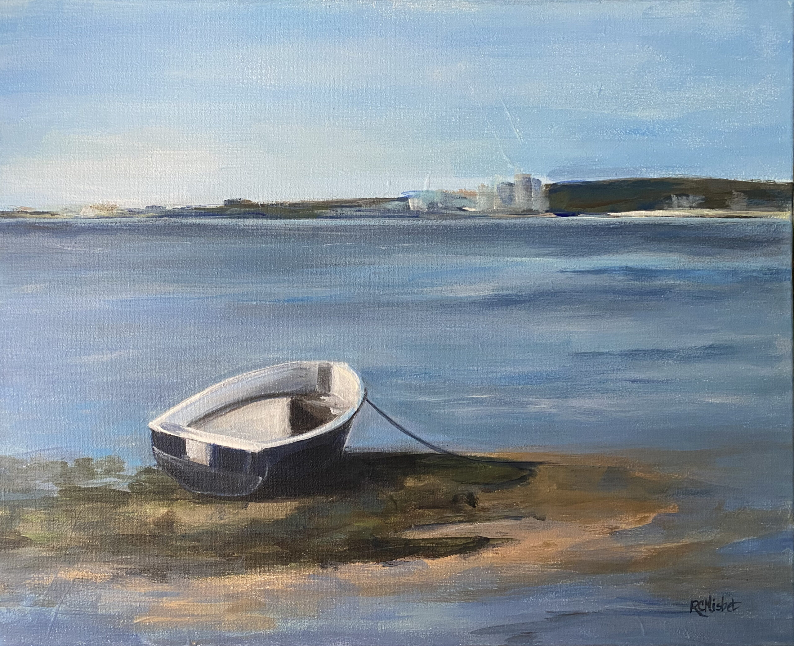 Little row boat on an outcropping of land with a city shoreline in the distance.