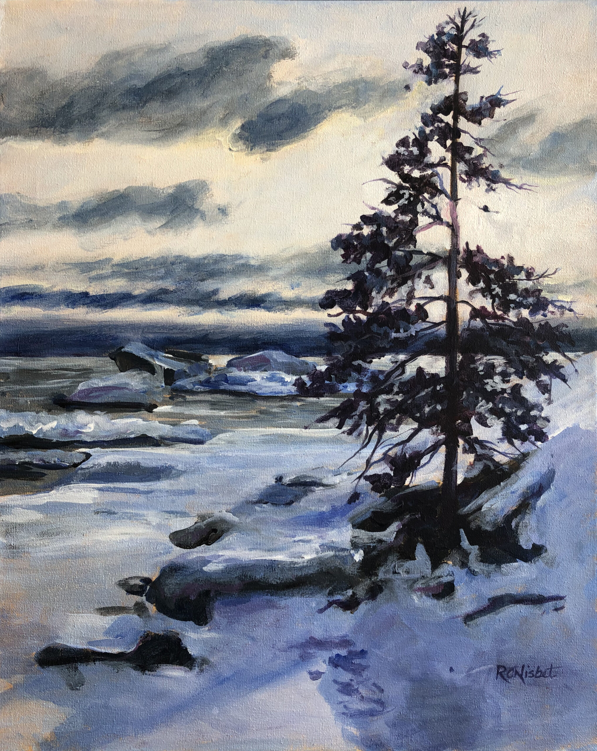 Single tree sits at edge of snowy lake bank during sunset.