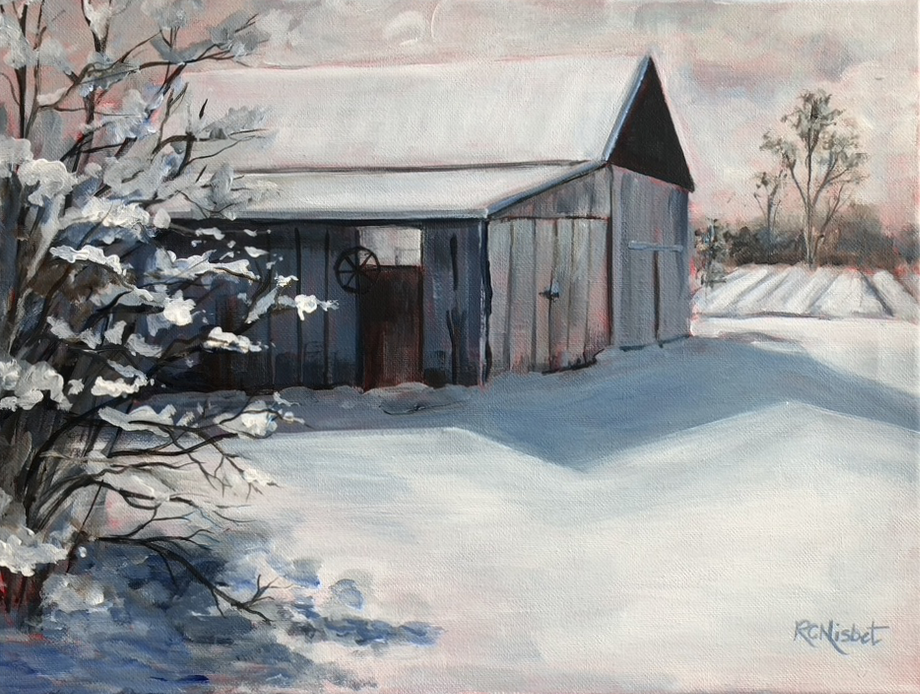 Barn in snowy field with a tree in front of it.